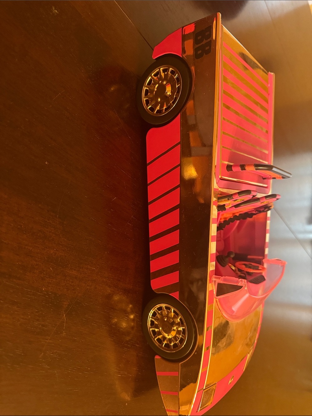Pink, gold and Black Toy OMG Convertible Car- don’t believe the lights work